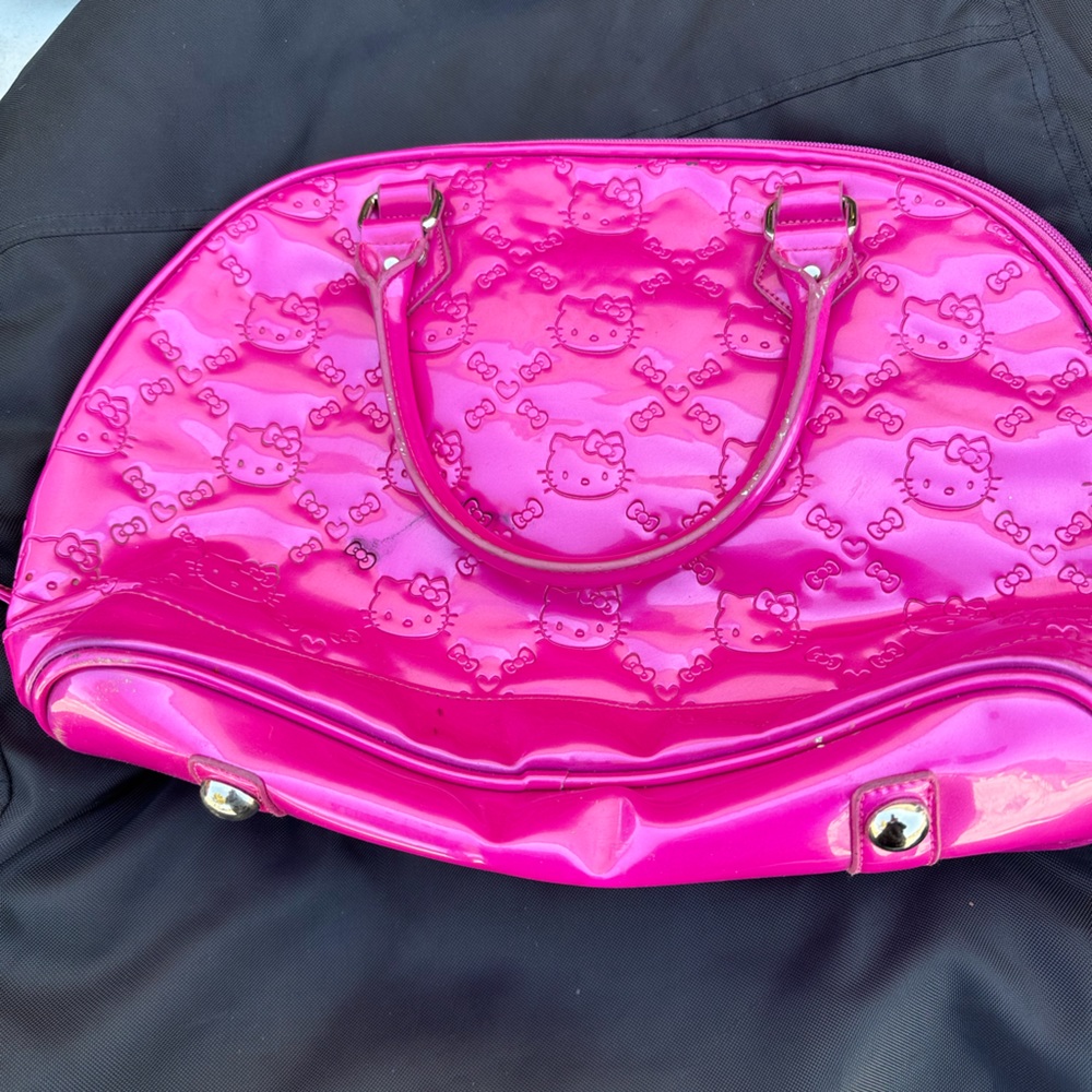 Pink hello kitty duffel bag.